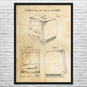 May include: A framed vintage patent print of a computer, dated September 16, 1986. The print shows three different views of the computer, including a front, side, and top view. The print is on aged paper.