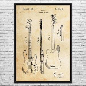 May include: A framed vintage patent illustration of a guitar, dated March 24, 1953. The drawing shows three views of the instrument, including a side profile and front view, with the text "Guitar" and "Filed Nov. 21, 1952".