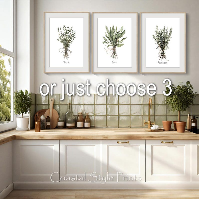 May include: Three framed botanical prints featuring watercolor illustrations of thyme, sage, and rosemary. Each print displays the herb's name below the image. The prints are displayed above a white cabinet and wooden countertop.