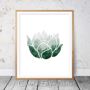 May include: A green watercolor illustration of a lotus flower with a forest scene inside. The image is framed in a light wood frame.