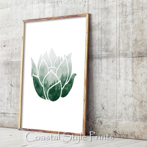 May include: A green watercolor illustration of a stylized flower with a forest scene inside the petals. The image is framed in a light wood frame.