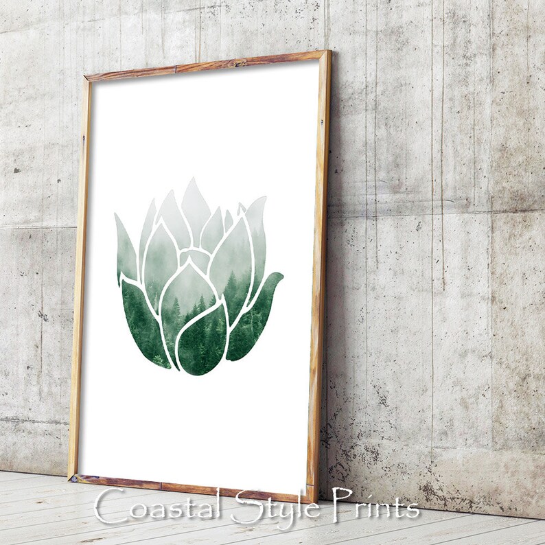 May include: A green watercolor illustration of a stylized flower with a forest scene inside the petals. The image is framed in a light wood frame.