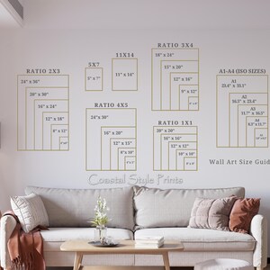 May include: Wall art size guide with various rectangular frames in gold against a white wall. The guide includes dimensions in inches for different ratios like 2x3, 4x5, 3x4, and 1x1, as well as ISO sizes. The text "Coastal Style Prints" is visible.