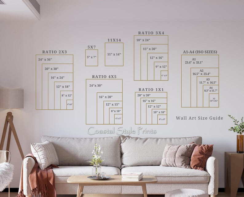May include: Wall art size guide with various rectangular frames in gold against a white wall. The guide includes dimensions in inches for different ratios like 2x3, 4x5, 3x4, and 1x1, as well as ISO sizes. The text "Coastal Style Prints" is visible.