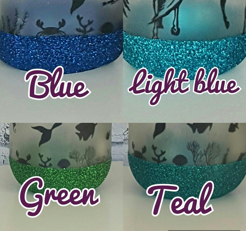 May include: Four glass jars with different colored glitter trim. The jars are decorated with a sea life theme and the glitter colors are blue, light blue, green, and teal. The words "Blue", "Light Blue", "Green", and "Teal" are written below each jar.