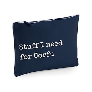 May include: A navy blue canvas zippered pouch with the text "Stuff I need for Corfu" in white.