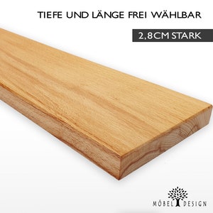 Può includere: Un ripiano in legno naturale con una finitura liscia di colore marrone chiaro. Il ripiano è spesso 2,8 cm e la lunghezza e la profondità sono personalizzabili. Il testo "TIEFE UND LÄNGE FREI WÄHLBAR" e "2,8CM STARK" è visibile nell'immagine.