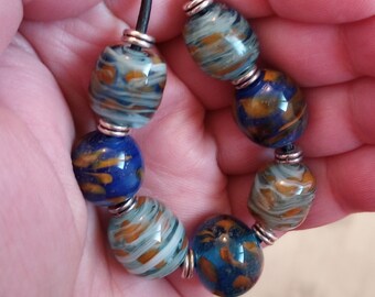 Handmade Glass Art - 18-Inch Necklace of Lampwork Glass Beads in Shades of Blue with Added Copper Frit - Studio Glass Art You Can Wear