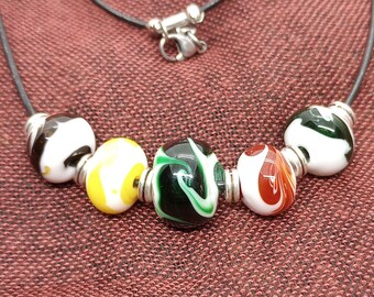 Handmade Lampwork Glass Bead Necklace on Black Leather Cord - Opaque White Glass with Green, Brown, Yellow and Red - Glass Art You Can Wear