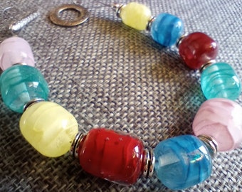 Handmade Lampwork Glass Bead Bracelet Enhanced with Colored Enamels in Blue, Red, Pink and Yellow - Glass Art You Can Wear - Studio Glass