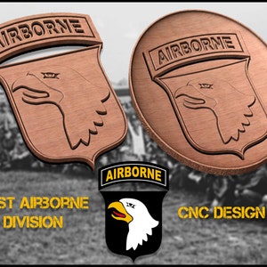 May include: A wooden 101st Airborne Division patch with a brown eagle head and the words "AIRBORNE" in yellow letters. The patch is on a brown background with a blurred image of soldiers in the background. The text "101ST AIRBORNE DIVISION" and "CNC DESIGN" are also visible in the image.