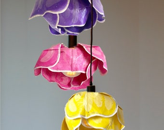 over-sized paper flower lampshades These stunning shades come in pastel colors of yellow, pink, and lavender