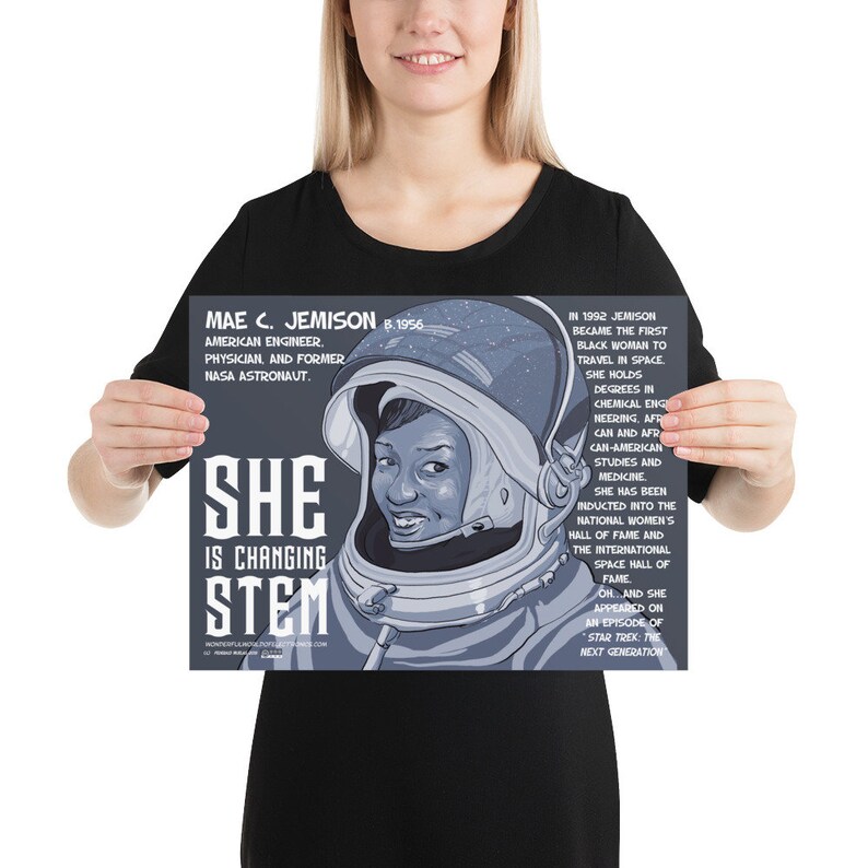 May include: A rectangular poster featuring a stylized illustration of Mae C. Jemison in a space helmet. The text includes her biography, the phrase "SHE IS CHANGING STEM," and details about her career as an engineer, physician, and astronaut.