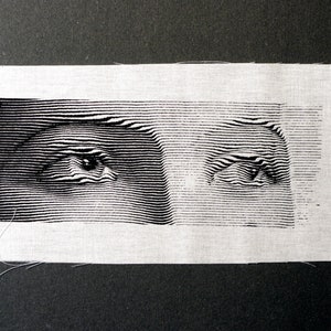 Ögonlinjer screentryckt lapp på vit bomull