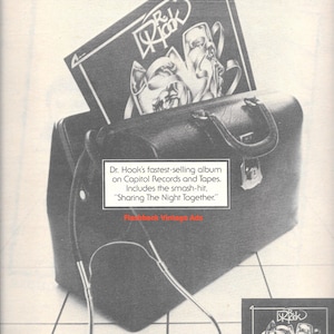 May include: A vintage advert showing a black leather doctor's bag with a Dr. Hook album cover. The album, titled "Pleasure & Pain", includes the hit song "Sharing The Night Together." The advert is from Flashback Vintage Ads.