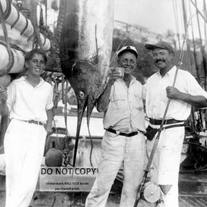 Ernest Hemingway with a Marlin (Fish) in Havana Harbor in 1932 - 8X10 or 11X14 Photo (DD-178)