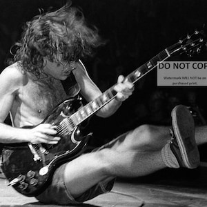 AC/DC Co-Founder and Lead Guitarist Angus Young, in Concert - 8X10 or 11X14 Photo (WW188)