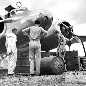 Amelia Earhart Oversees the Refueling of Her Lockheed Electra Aircraft in Venezuela- 5X7, 8X10 or 11X14 Photo (CC706)