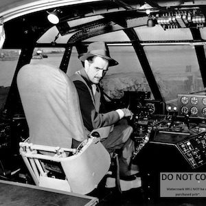Howard Hughes Sits in the Cockpit of the "Spruce Goose" Aircraft - 5X7, 8X10 or 11X14 Photo (AA-032)