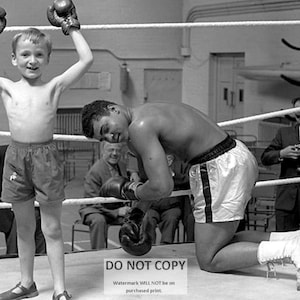 Muhammad Ali &quot;Goes Down&quot; in the Ring Thanks to a Kid - 8X10 Publicity Photo (ZY-157)