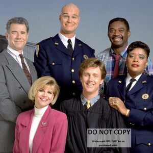 May include: Group photo of six people, including a judge, police officers, and individuals in business attire, posing in front of a bridge. The image has a watermark that reads "DO NOT COPY".