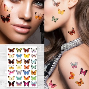 May include: A sheet of temporary butterfly tattoos with 24 different designs. The sheet is white with a black border and the text "57-L-23" printed in the center. The butterflies are colorful and have various patterns.