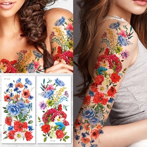 May include: Two temporary tattoo sheets with colorful floral designs. The designs feature red, blue, yellow, and white flowers. The sheets are labeled "ST-224" and "ST-40".