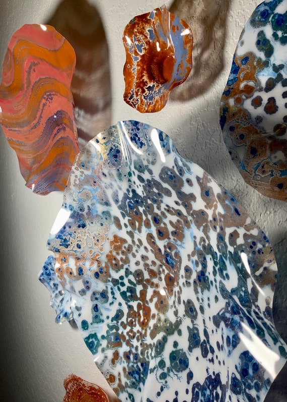 7 piece handmade recycled plastic- wall flowers terra-cotta, gold. orange, copper, white & blue- looks like glass