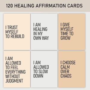 May include: A set of 120 healing affirmation cards. Each card features a different positive statement in a bold, black font against a neutral background. Affirmations include "I trust myself to rebuild" and "I choose calm over chaos."
