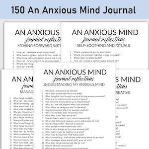 May include: A stack of white paper journals with the title "An Anxious Mind Journal" in black text. Each journal has prompts for self-reflection, including topics like self-soothing, rituals, and understanding anxiety.