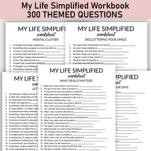 May include: A stack of white workbooks titled "My Life Simplified Workbook" with the text "300 THEMED QUESTIONS." Each workbook features different prompts for self-reflection, such as "Mental Clutter" and "Decluttering Your Space."