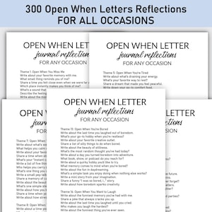 May include: A stack of white cards with black text, titled "300 Open When Letters Reflections For All Occasions." Each card reads "Open When Letter journal reflections FOR ANY OCCASION" with prompts.
