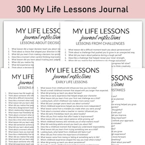 May include: A stack of white paper journals with black text. The top journal reads "300 My Life Lessons Journal" in pink. Each journal has a different list of prompts for self-reflection, such as "Lessons About Decisions" and "Early Life Lessons."