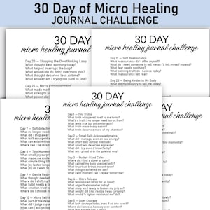 May include: A stack of white paper sheets with the text "30 Day of Micro Healing Journal Challenge" in black. Each sheet contains daily prompts for self-reflection and journaling, encouraging mindfulness and personal growth. The design is simple and clean.