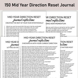 May include: A stack of white journals with prompts for self-reflection. The journals are titled "Mid-Year Direction Reset Journal" and include questions about goals, habits, and priorities. The text is in black on a white background.