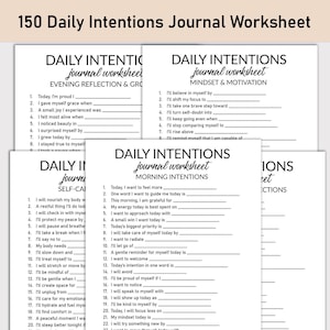 May include: A stack of white paper journal worksheets with prompts for daily intentions. The worksheets are titled "Daily Intentions Journal Worksheet" and include sections for morning, evening, and self-care reflections. The text "150 Daily Intentions Journal Worksheet" is at the top.