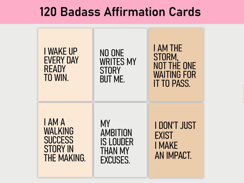 May include: Six affirmation cards with inspirational quotes printed on them. The cards are peach colored with black text. The quotes are: "I wake up every day ready to win." "No one writes my story but me." "I am the storm, not the one waiting for it to pass." "I am a walking success story in the making." "My ambition is louder than my excuses." "I don't just exist I make an impact."