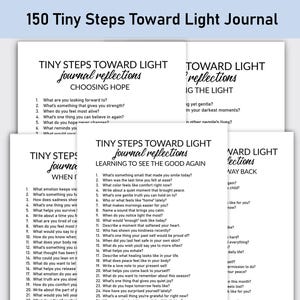 May include: A stack of white journal pages with prompts for self-reflection. The title "150 Tiny Steps Toward Light Journal" is at the top. Each page has a different theme, such as "Choosing Hope" and "Learning to See the Good Again."