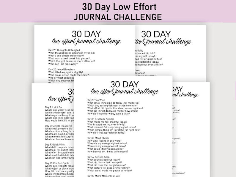 May include: A stack of white paper sheets with the text "30 Day Low Effort Journal Challenge" in a handwritten style. Each sheet contains prompts for daily journaling, encouraging self-reflection and mindfulness.