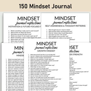 May include: A stack of white journals with the text "150 Mindset Journal" at the top. Each journal has a different title, such as "Motivation & Future-Focused Thoughts" and "Self-Awareness & Thought Patterns."