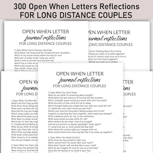 May include: A collection of white cards with black text, labelled "300 Open When Letters Reflections For Long Distance Couples." The cards contain prompts for couples, including "Open When You're Having a Hard Day" and "Open When You Miss Me."