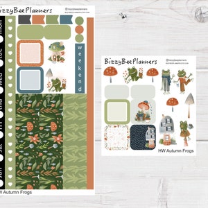 May include: A set of planner stickers featuring frogs, mushrooms, and houses. The stickers are on a white background with the text "HW Autumn Frogs" at the bottom. The stickers are designed for use in a planner or journal.