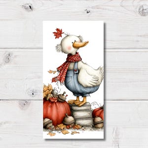 May include: A whimsical illustration of a white duck wearing a red polka-dot scarf and blue denim overalls. The duck stands on a stack of books next to a large orange pumpkin and several acorns, with a single red maple leaf resting on its head.