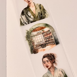 May include: Two watercolor illustrations of women wearing green and white kimonos with floral patterns. The illustrations are set against a white background with a small watercolor illustration of a room with a window and shelves in the middle.