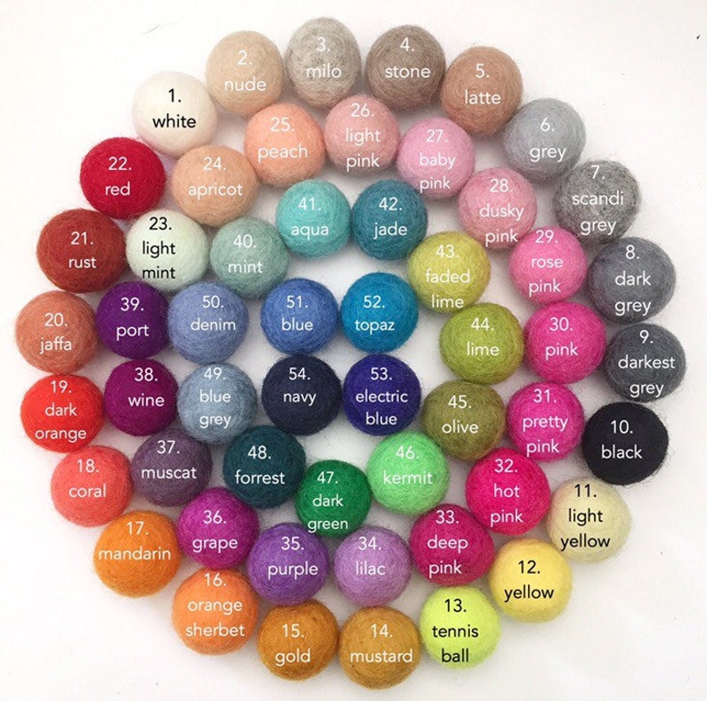 May include: A color chart of 54 felt balls, each with a different color and a number. The colors include white, red, orange, yellow, green, blue, purple, pink, brown, grey, and black.