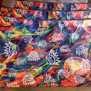 May include: Four colorful zippered pouches with a psychedelic swirl pattern and white cartoon faces.