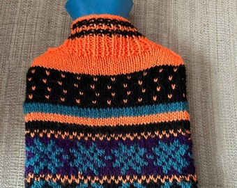 Handmade knitted hot water bottle cover and bottle