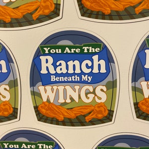 May include: Four blue and white stickers with the text "You Are The Ranch Beneath My Wings" and a cartoon image of chicken wings.