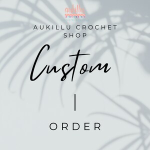 May include: Aukillu Crochet Shop logo with the text "Custom Order" in a handwritten font. The background is a light gray with a shadow of a palm leaf.