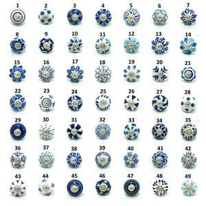 May include: A collection of 49 decorative ceramic cabinet knobs, each with a unique blue and white floral or geometric design. The knobs are numbered 1 through 49, offering a variety of styles for furniture or home decor projects.